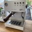 White Ascaso Steel UNO PID espresso machine with wooden elements and manual cleaning function.