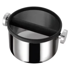 Stainless steel Motta knock box for use with a coffee machine.
