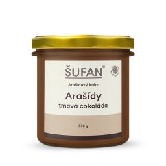 Spoon peanut-chocolate spread in a glass jar with a golden lid Spoon peanut-chocolate spread in a glass jar with a golden lid
