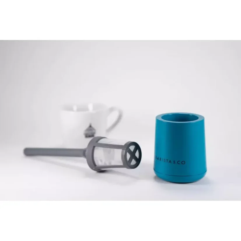 Easily collapsible plastic strainer with a blue container suitable for travel, and a white cup with a logo in the background