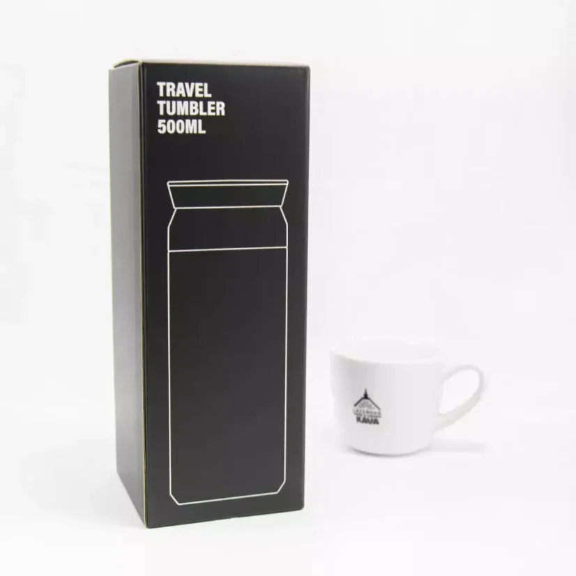 Original packaging of the Kinto Travel Tumbler Coyote 500ml with a white cup in the background