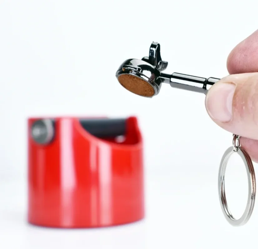 Porte-clés avec un décapsuleur pour café.