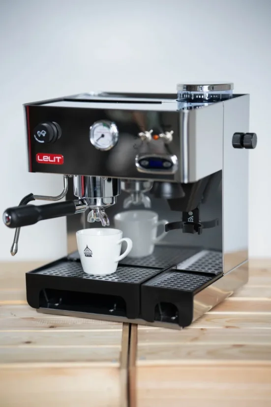 Espresso machine with grinder for making coffee.