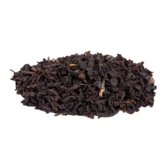 Loose black tea English Breakfast Broken on a white background, side view Loose black tea English Breakfast Broken on a white background, side view